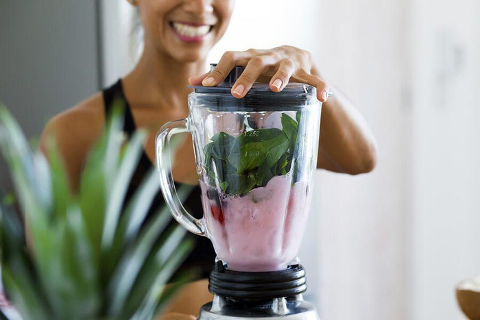 women making a smoothie