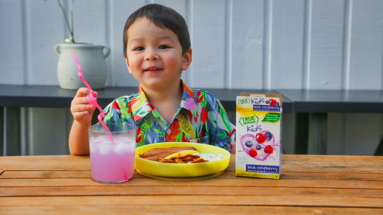 child eating summer snacks