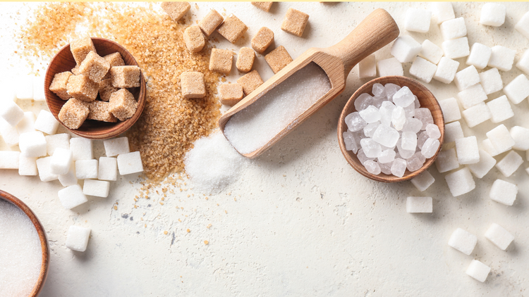 Stevia, Splenda, and other sugar replacements laid out on a table. 