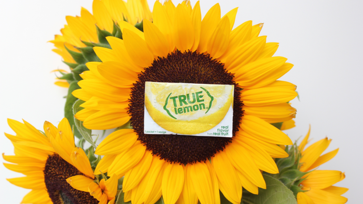 Packet of True Lemon on top of a sunflower. 