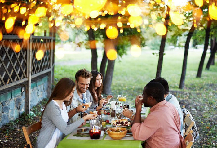 group of friends eats outside